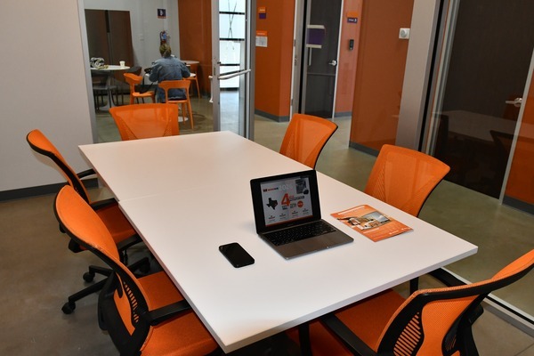 WorkHub Flex conference room with orange chairs
